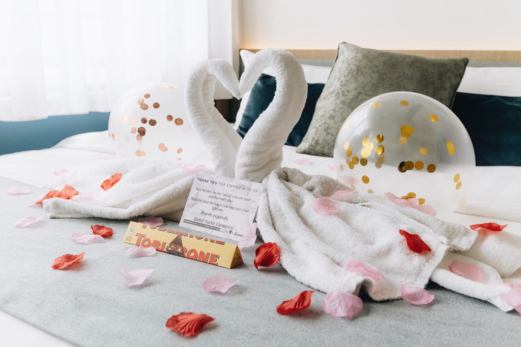 Hotel Room Decoration with Confetti Balloon, Towel Swan, Toblerone Chocolate, Rose Petals & Hand Written Card